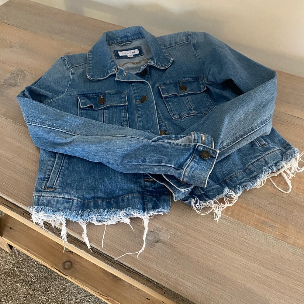 Versatile fringed jean jacket. Excellent condition.